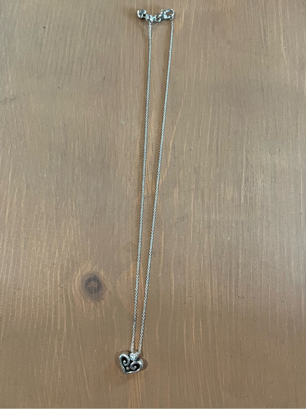 Heart with cz silver tone necklace longer adjustable on side with heart pull euc